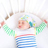 Baby use Tortle repositioning beanie to treat flat head syndrome cause by preference to sleep on one side